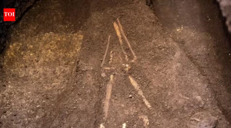 El Salvador archaeologists lifted a burial sealed beneath 2,800-year-old volcanic ash; the person lay face down with a sea turtle-shaped vessel near one hand |
